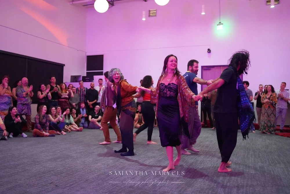 Dancers and audience at Radiant Hearts Fest — joy, presence, community